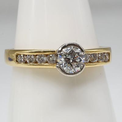 18ct Yellow Gold Ring with 0.30ct Round Brilliant Cut Diamond and Eight Round Brilliant Cut Diamonds