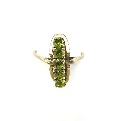 9ct Yellow Gold Ring with Five Round Cut Peridot in a Bridge Design