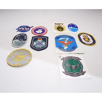 Quantity of US and Australian Naval Stickers Including a US Seventh Fleet Sticker and a Group Cloth Patches, Including NASA and Queensland Polic