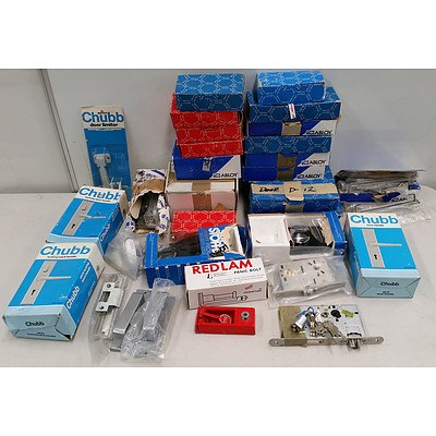 Assorted New and Used Door Locking Components Including; Internal Mechanisms, Dead Bolts, Handles and More