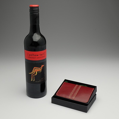 Men's leather wallet and bottle of red wine I