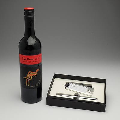 Silver luggage tag & pen & bottle of red