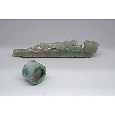 Chinese Pale Apple Green Jadeite Chilong Pipe and an Archers Ring, Late Qing or Republic Period