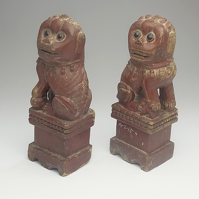 A Pair of Brown Lacquered Carved Wood Buddhist Lions