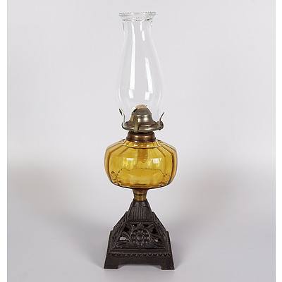 Table Oil Lamp with Amber Ribbed Glass Font and Decorative Cast Iron Base