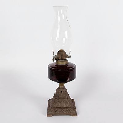 Table Oil Lamp with Deep Amber/Brown Glass Font and Decorative Cast Iron Base