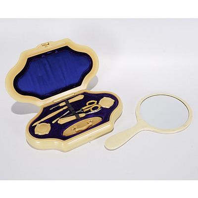 Art Deco Manicure Set of Xylonite with Fitted interior and Bevelled Hand Mirror Also of Xylonite