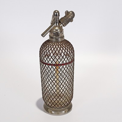 Soda Syphon 1930s, Encased in Wire Mesh with Red Filling Line. Imprinted 'Maker Aerators Ltd London'