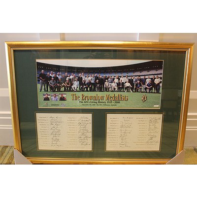 Mounted and framed photograph of 50 Brownlow Medallists at the MCG in early 2000s - with signatures