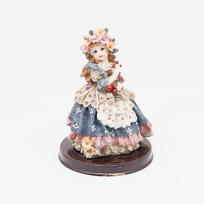 Resin Figure of Small Girl in Layered Dress with Floral Accents