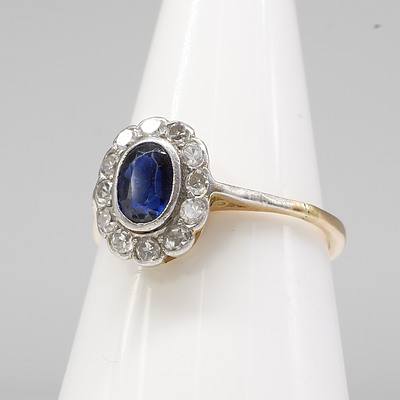 18ct Yellow and White Gold Ring with Oval Facietted Royal Blue Natural Sapphire and Twelve Single Cut Diamonds