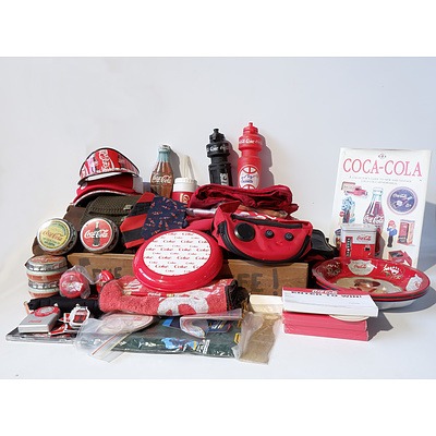 Large Group of Coca Cola Merchandise Including Books, Clothes, Magnets, Bottles, Sports Bags and Much More