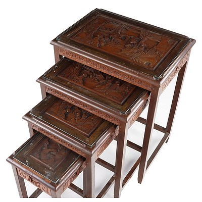 Set of Four Carved Chinese Teak and Glass Top Nesting Tables