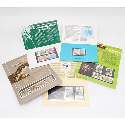 Large Group of Australian Stamp Packs Including XII Commonwealth Games Brisbane 1982, Famous Australian Aviators, Queen's Birthday Sheetlet and More