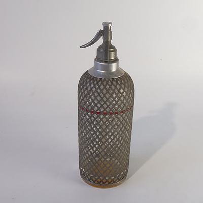 A 1920s Wire Netted Glass Soda Siphon Size C