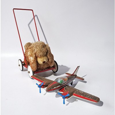 A Vintage Wheeled Push Soft Toy Dog and Tin Aeroplane
