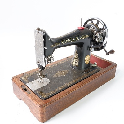 A British Manufactured Singer Sewing Machine on Wooden Base