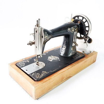 AN Australian manufactured Ward Brothers Sewing Machine on  Wooden Base