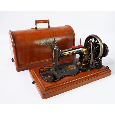 A Singer U.S.A. Brand Sewing Machine in Wooden Carry case
