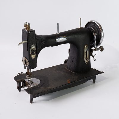 A White Rotary Brand Sewing Machine