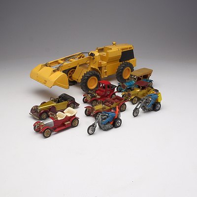A Quantity of  Nine Toy Cars Including Ertl Brand Front End Loader, and Five Matchbox Models of Yesteryear