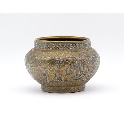 Antique Cairo Ware Silver and Copper Inlaid Engraved Brass Bowl Decorated with Arabesques, Cairo or Damascus Circa 1900