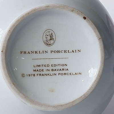 A Royal Doulton 'Embroiderer' Porcelain Statuette, Two Franklin Mint Porcelain Vases and a Violet Fluted Glass Lamp Shade