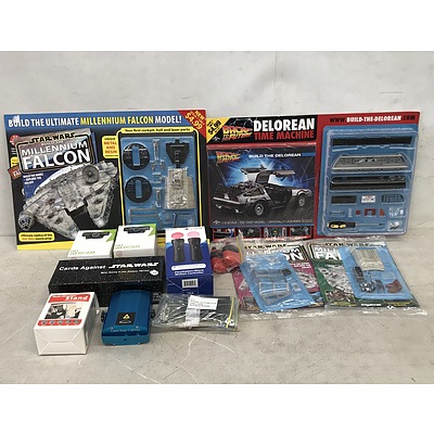 Group of Household Items Including Console Accessories and Model Construction Kits