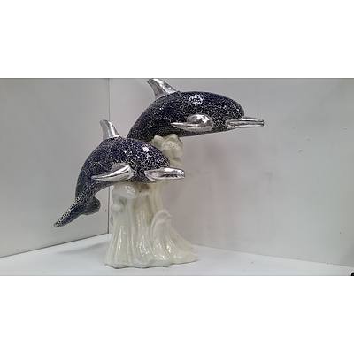 Composite dolphine statue