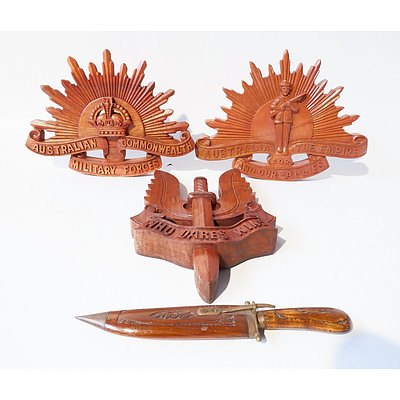 Three Carved Military Insignia Plaques and One Small Knife with Wooden Scabbard
