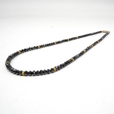 Strand of Facetted Rondell of Black Diamonds with 22ct Yellow Gold Beads and 18ct Gold Clasp