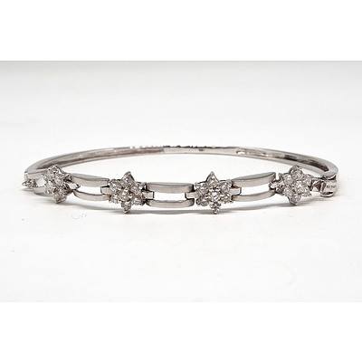 18ct White Gold Bracelet with Four Flower Clusters of Round Brilliant Cut Diamonds