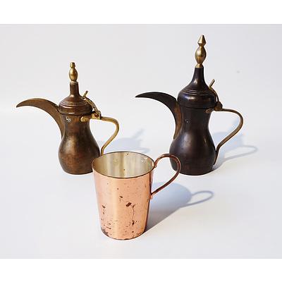 Two Middle Eastern Copper and Brass Coffee Pots and a Copper Mug