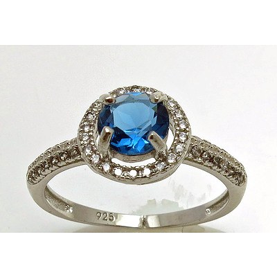 Sterling Silver Ring - Topaz Blue Colour Cz With White Cz Halo & Shoulders