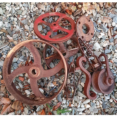 A Group of Vintage Cast Metal Wheels,Traps, Pulley and More