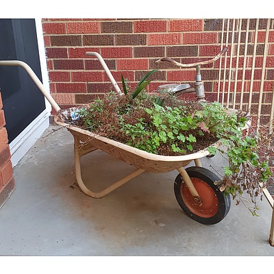 A Vintage Child's Tricycle and Wheelbarrow