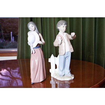 A Lladro Girl with Hat Figure and a Nao Boy Checking His Watch