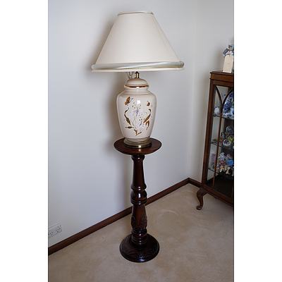 An Antique Style Mahogany Pedestal with a Glazed Ceramic Lamp