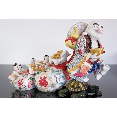 A Chinese Ceramic Buddha Figural Group, Modern
