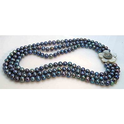 Triple Strand of Peacock Black Pearls, With Carved Shell Clasp