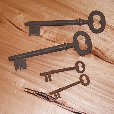 Two Large and Two Small Vintage Cast Metal Keys