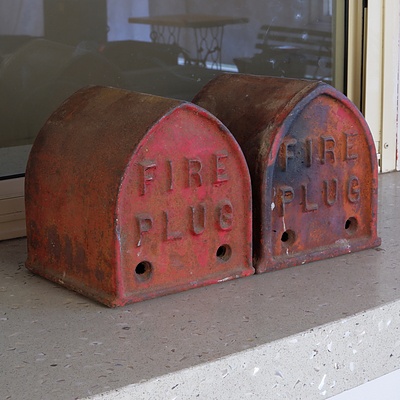 Two Vintage Cast Iron Fire Plug Covers