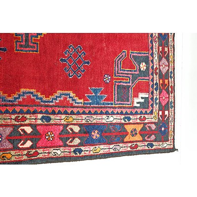 Persian Hamadan Hand Knotted Wool Pile Rug with Central Medallions and Eight Guls on a Red Ground