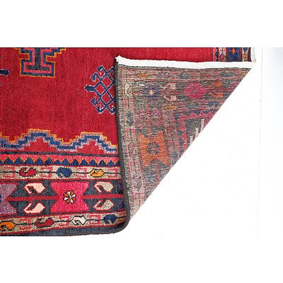 Persian Hamadan Hand Knotted Wool Pile Rug with Central Medallions and Eight Guls on a Red Ground
