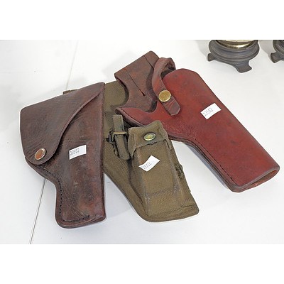 Two Leather And One Canvas Holsters
